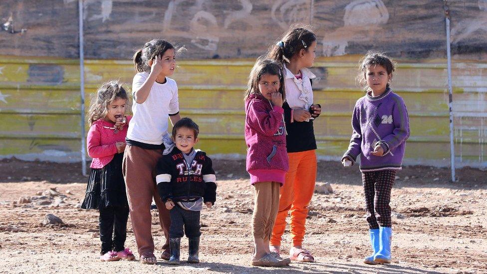 Syrian children play at the Zaatari refugee camp, Jordan