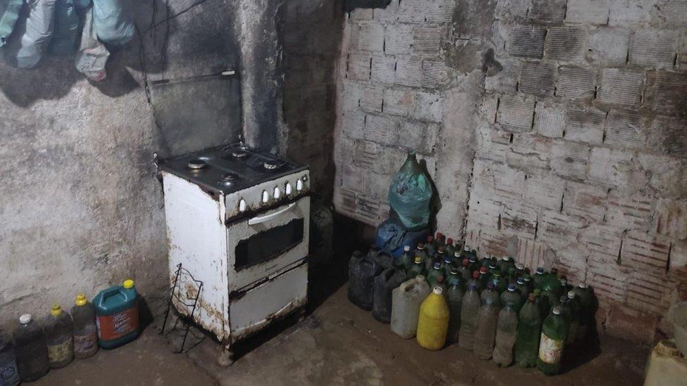 An old stove inside a room in the house where the three people were held captive for 17 years