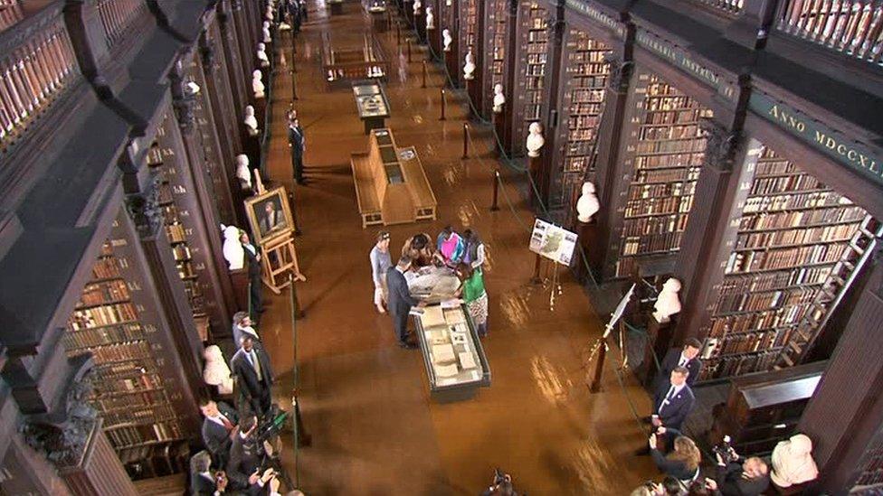 Michelle Obama and her daughters toured Trinity College's library in 2013