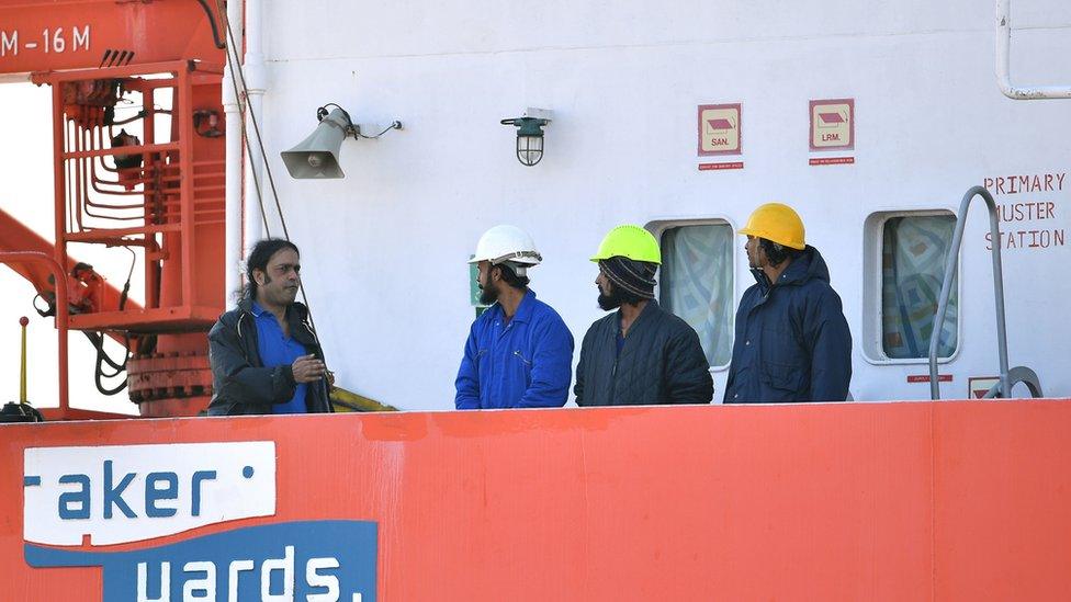 Captain Nikesh Rastogi, 43, from Mumbai, (left) with his crewmates