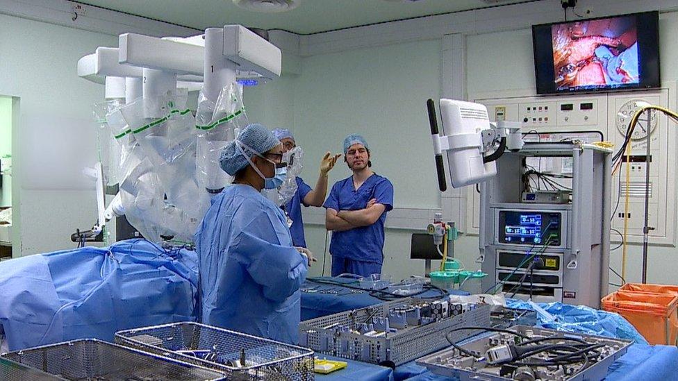 Surgeons using the robot