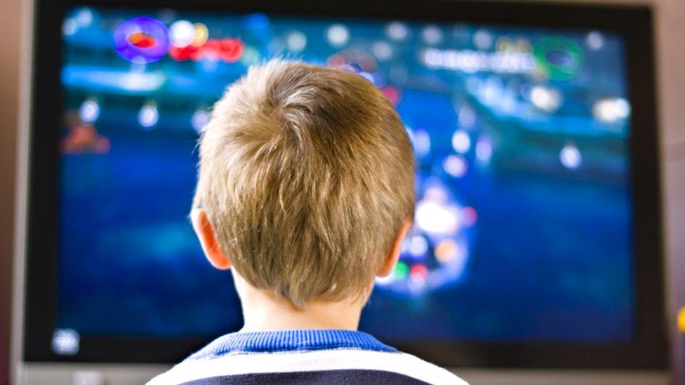 Boy playing computer game