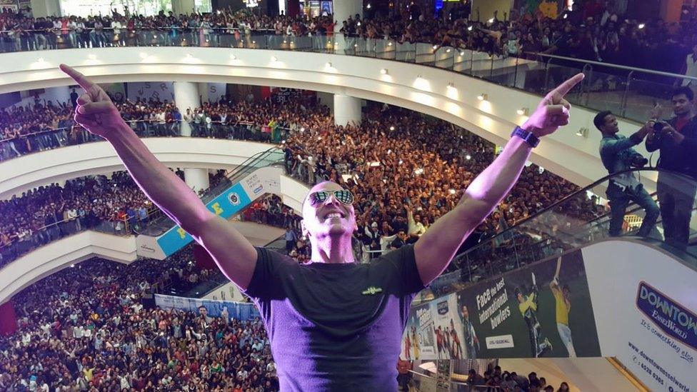 Akshay Kumar posing in front of huge crowds