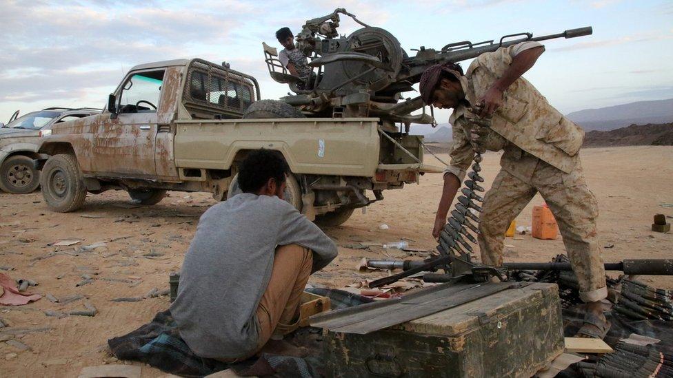 Yemeni tribesmen from the Popular Resistance Committees, supporting forces loyal to Yemen's Saudi-backed President Abdrabbuh Mansour Hadi, prepare and review ammunition in the area of Sirwa, west of the city of Marib.