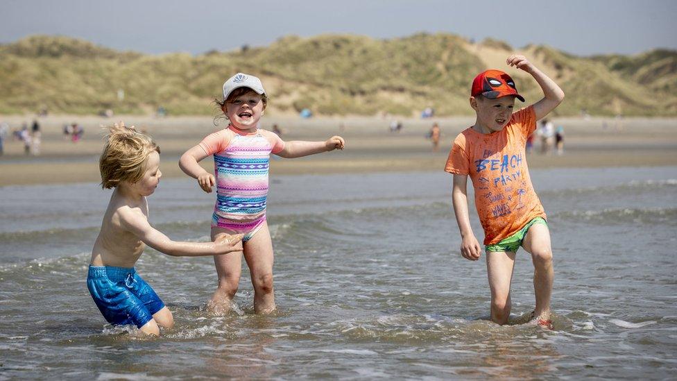 children-jumping-in-the-water