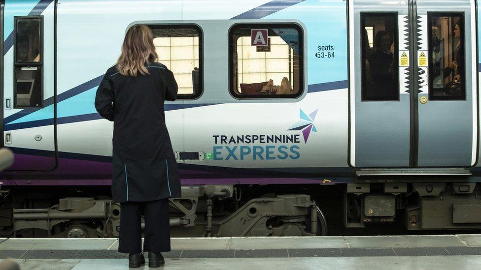 View of Transpennine Express train at a station platform