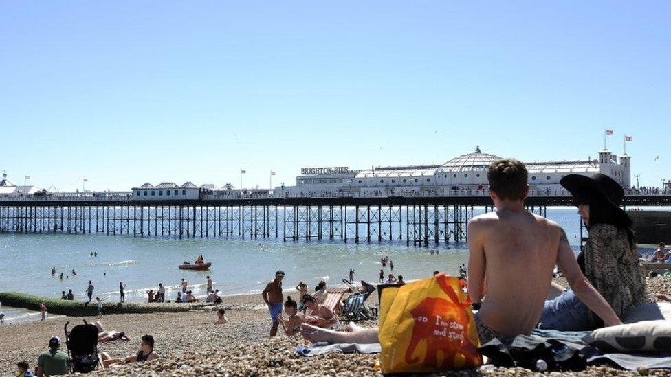 People sitting on Brighton beach