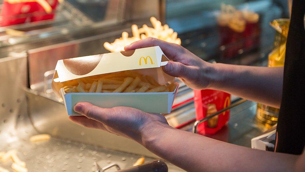 Worker in a McDonald's kitchen