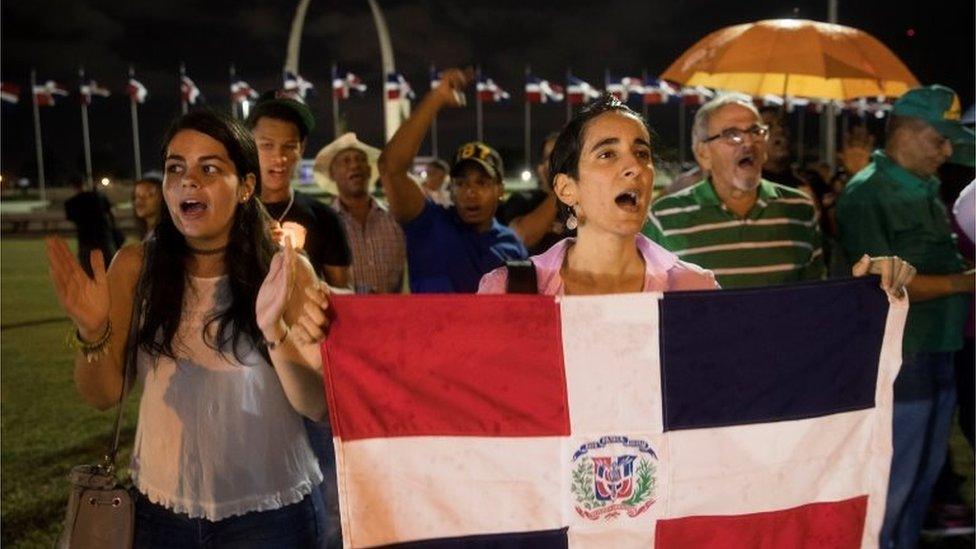 People protest at the headquarters of the Central Electoral Board, after municipal elections were suspended, in Santo Domingo, Dominican Republic, 16 February 2020