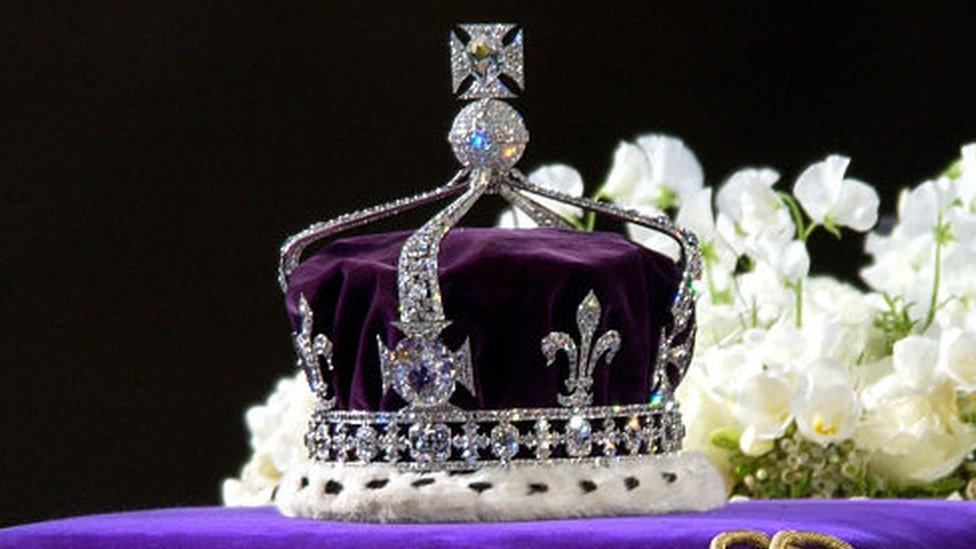 The coronation crown of the Queen Mother sits on top of her coffin.