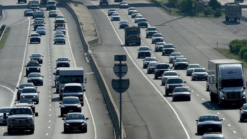 Automobile traffic moves along the Capitol Beltway during rush hour one day before the 4th of July holiday July 3, 2018 in Fort Washington, Maryland. The American Automobile Association (AAA) is predicting that 39.7 million Americans will drive 50 miles or more away from their homes during the Independence Day holiday week, a 5 percent increase over last year.