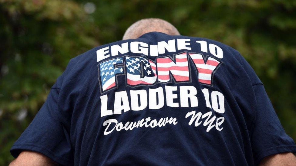 Lane Forman walks through the Contemplative Garden after touching his Star of David on the 9/11 memorial wall during the 17th Annual Massachusetts Commemorative Ceremonies on the Anniversary of September 11, 2001 in Boston