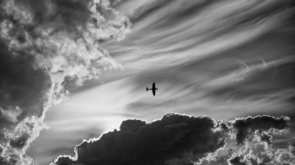 Spitfire and clouds