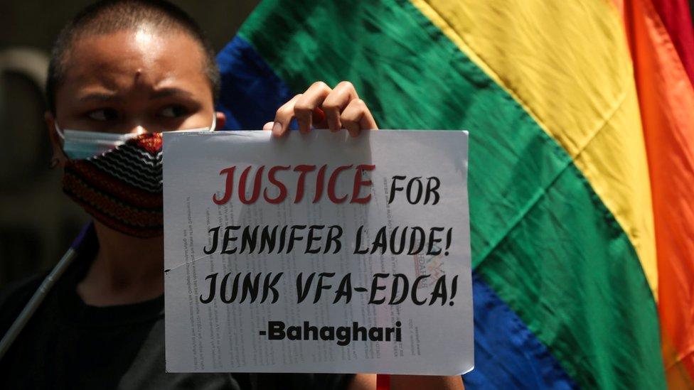 A supporter of a LGBTQ+ group protests the early release of U.S. soldier Lance Cpl. Joseph Scott Pemberton