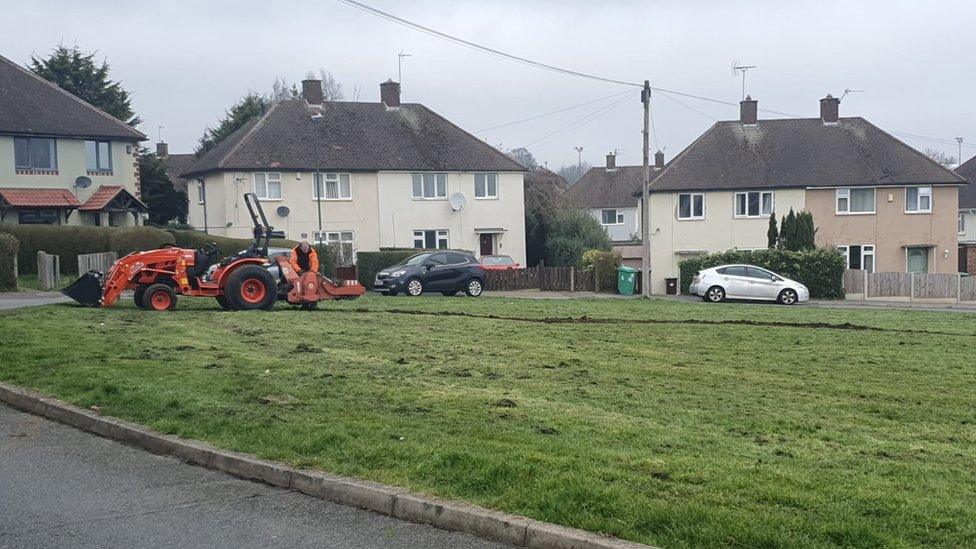 Man doing work to the green before the protest