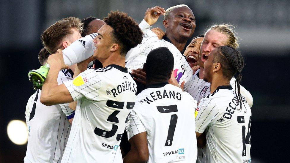 Jean Michael Seri of Fulham celebrates with team mates after scoring their team's sixth goal.