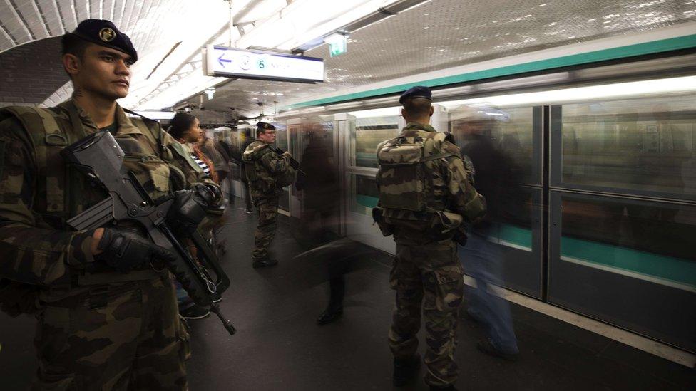 French soldiers stand guard in a metro station in Paris, 17 Nov 15