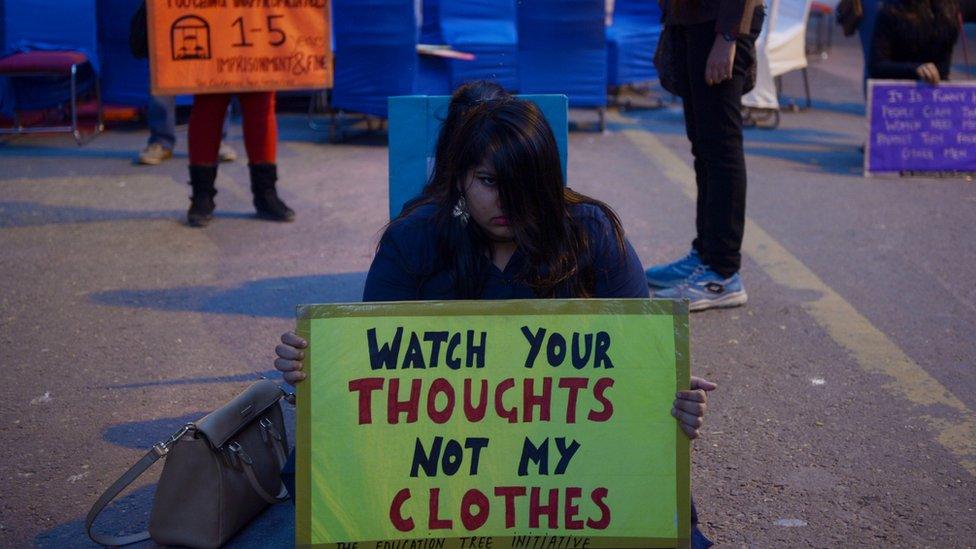 Indian protesters hold placards during a protest to mark the second anniversary of the fatal gang-rape of a student in the Indian capital