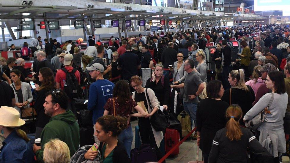 Long lines form at Sydney Airports T2 Domestic Terminal as passengers are subjected to increased security