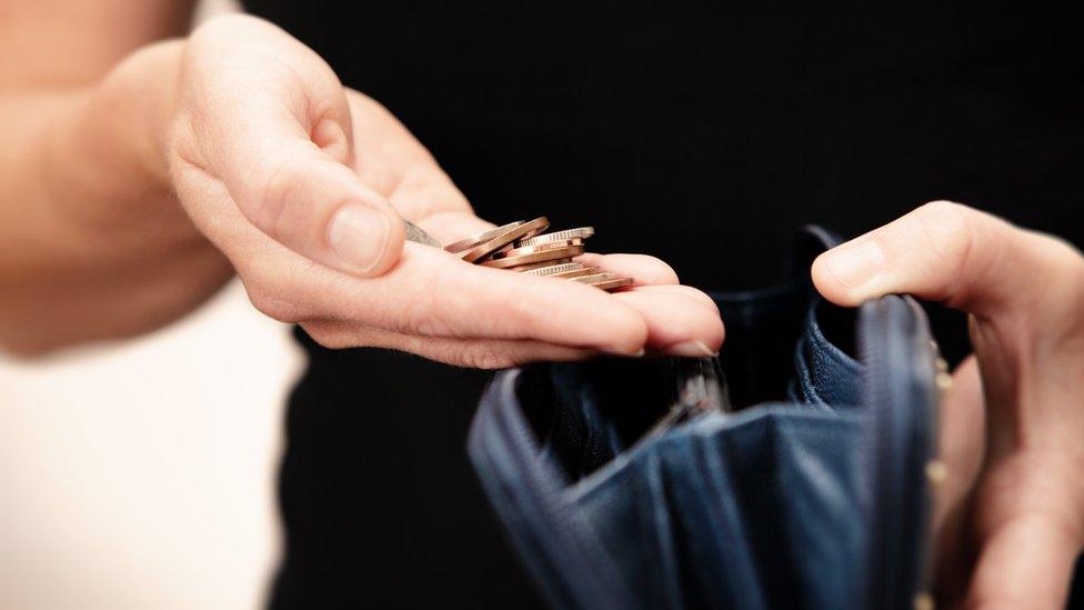 Woman counting coins