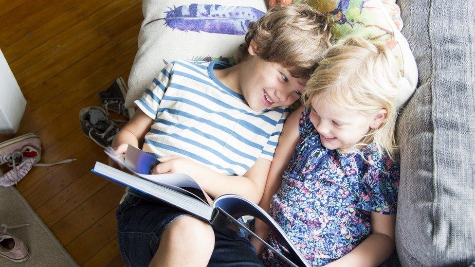 boy-and-girl-reading-together