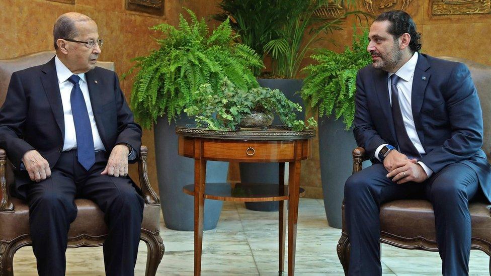 A handout picture shows Lebanese President Michel Aoun (L) and Prime Minister Saad Hariri (R) meeting at the presidential palace in Baabda, outside Beirut (22 November 2017)