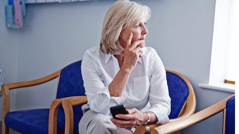 File picture of woman in waiting room