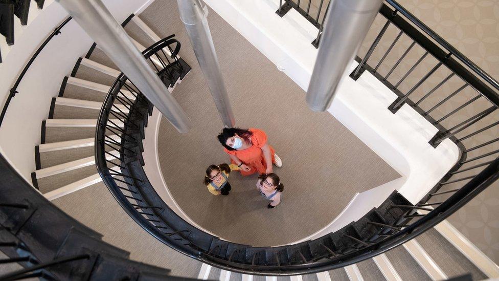 Judith, Iona and Beth Farshi by some stairs