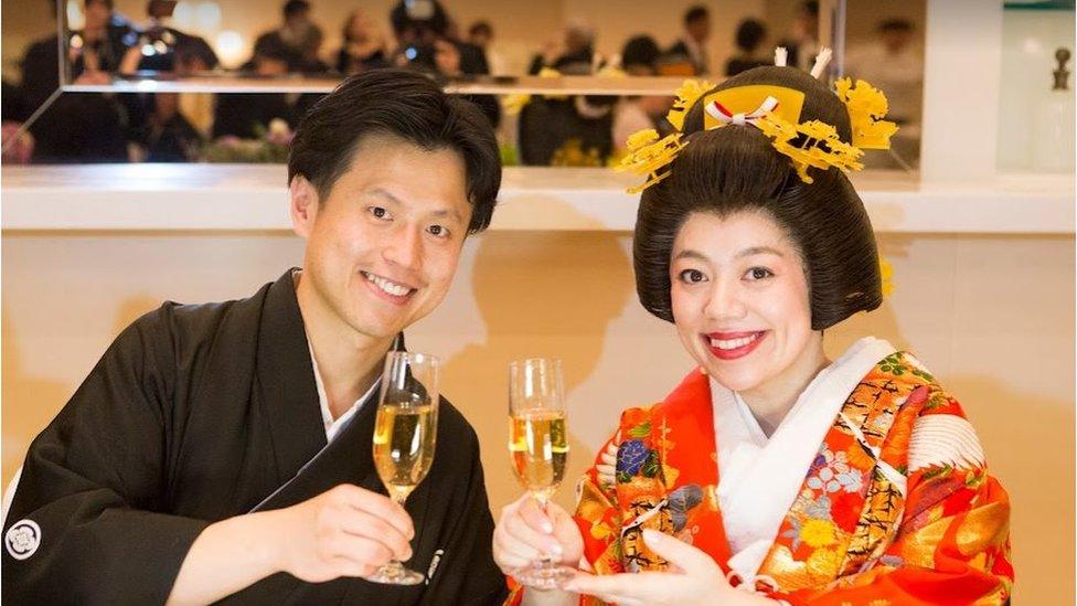 Jeff and Mizuki Hsu wearing traditional outfits