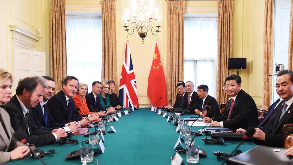 Cabinet room with UK and Chinese politicians