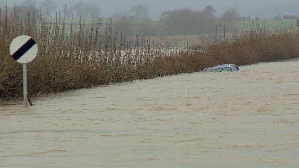 A car submerged in flood water near Coupar Angus