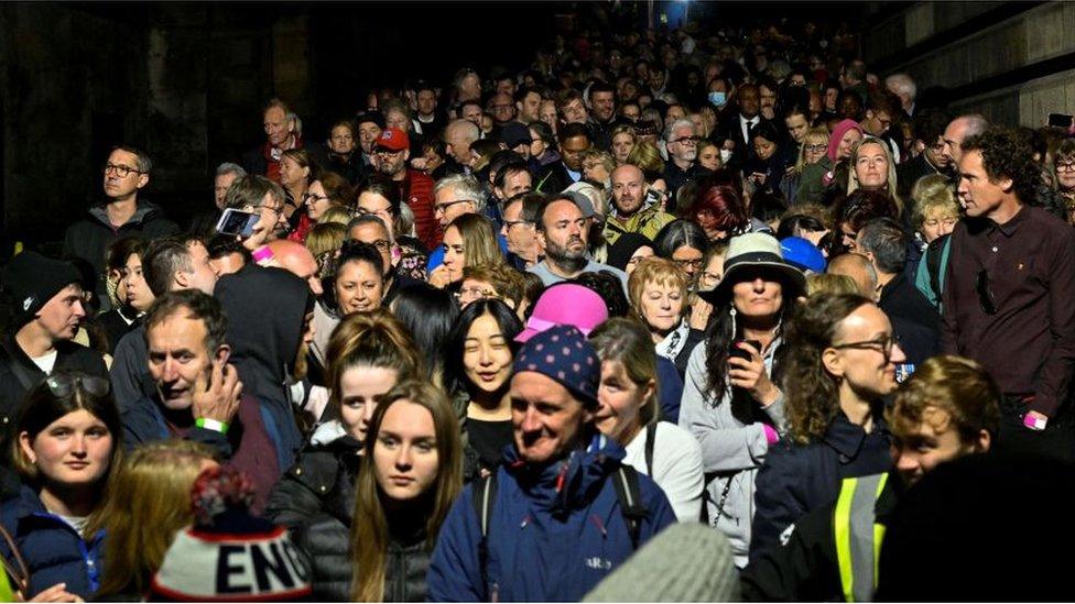 A crowd waiting to see the Queen's coffin at St Giles' Cathedral, Edinburgh.