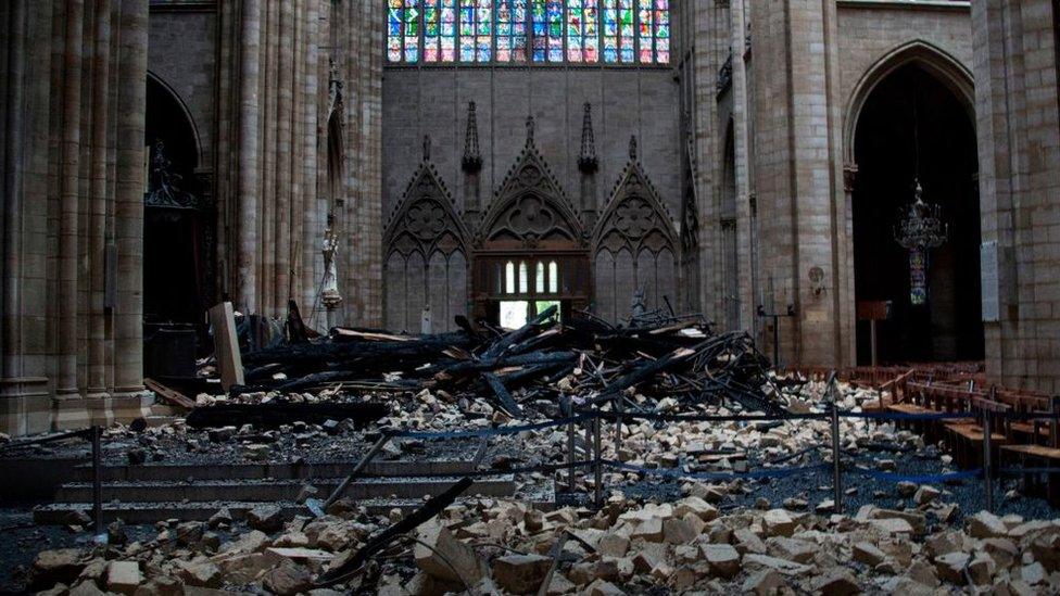 Debris on the floor of Notre-Dame cathedral after a fire tore through the building, April 2019