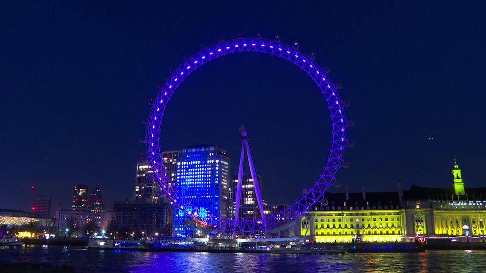 The London Eye lit up purple