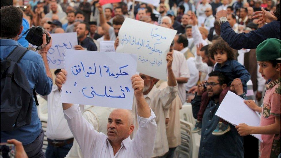 Supporters of the unity government shout slogans during a demonstration in Tripoli