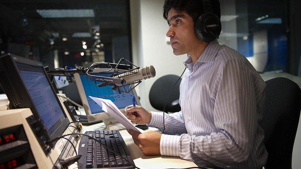 oice Of America (VOA) Afghan Service broadcaster Daoud Sediqi listens to a caller during a show on September 16, 2009 in a studio of the VOA in Washington.