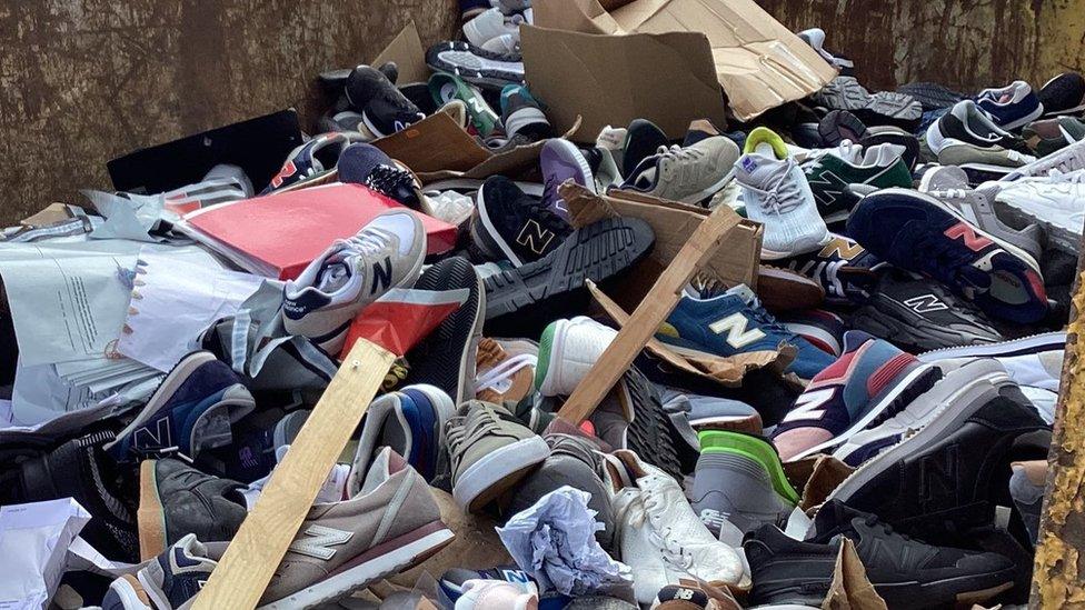 Outrage as hundreds of New Balance trainers found in skip BBC News