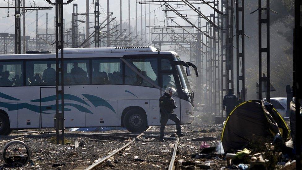 A bus carrying migrants heads south from the Idomeni border crossing in northern Greece. 9 Dec