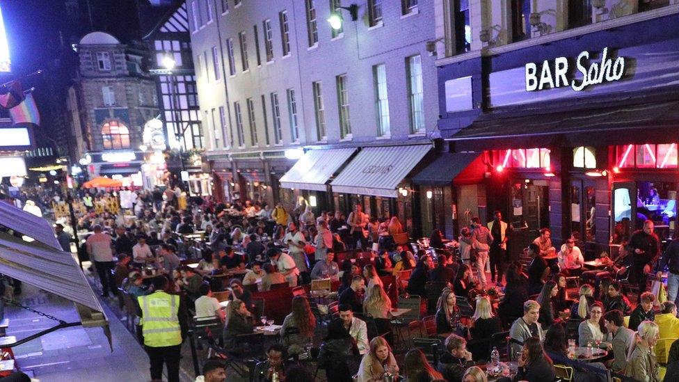 People in the street on Old Compton Street in Soho