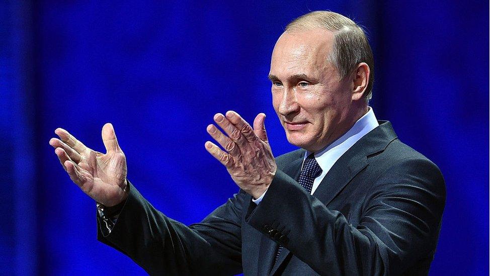 Vladimir Putin gestures