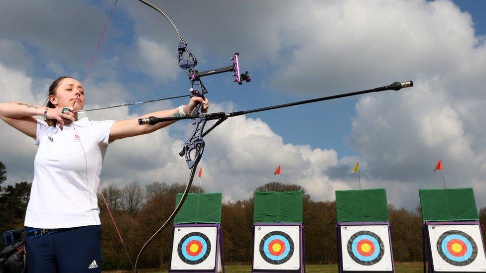 Bryony in practice with her bow and arrow