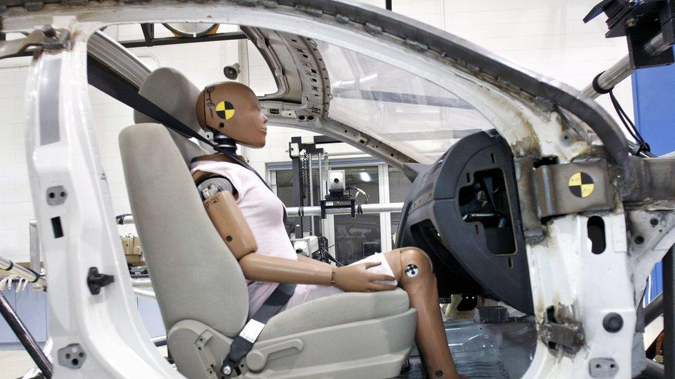 A crash-test dummy sits in a testing sled at Takata's current crash-testing facility in Michigan (2010)