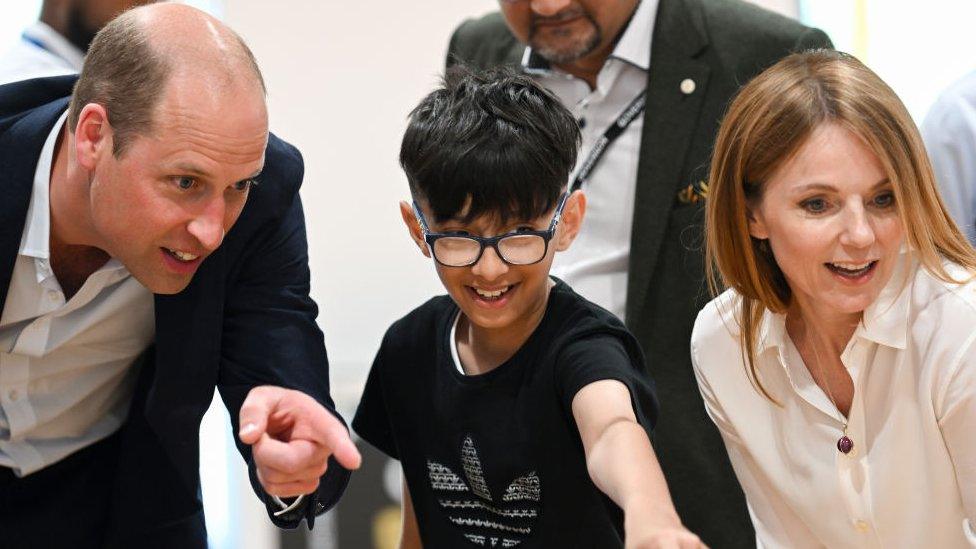 NEWPORT, WALES - JUNE 26: Prince William, Prince of Wales and Geri Halliwell meet children during a visit to Maindee Primary School on June 26,.