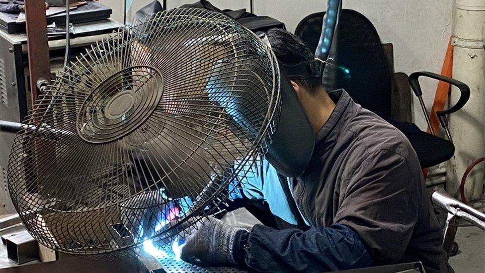 Worker Huang Xuefeng welding in a factory in Jiangsu, eastern China.