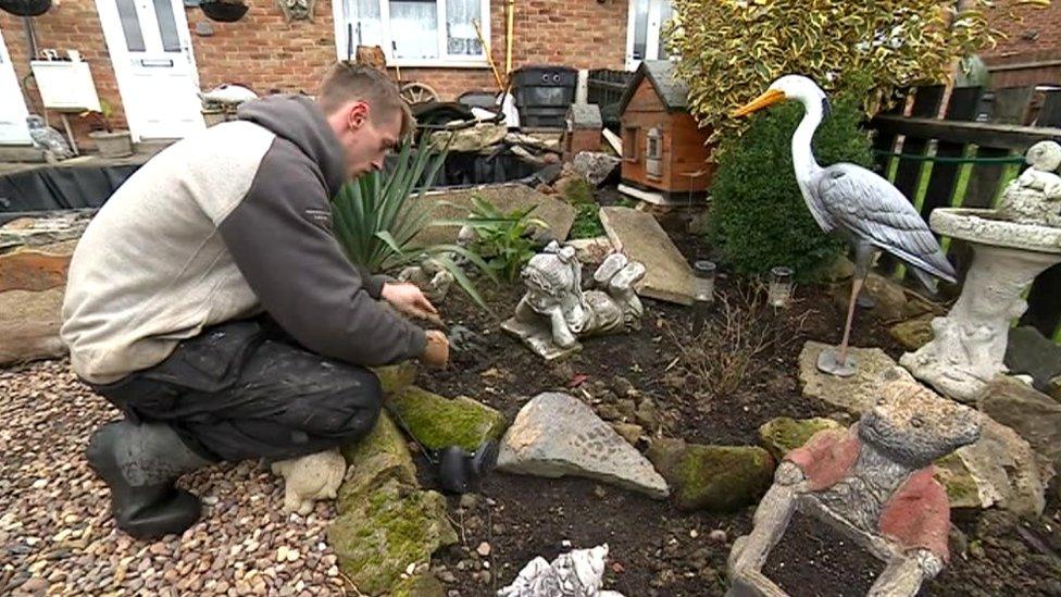 Ricky Booth in a memorial garden for Ayeeshia-Jayne's