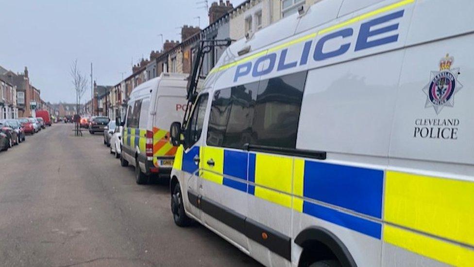 Police vans on a street