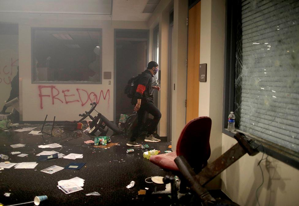 Protesters are seen inside Minneapolis Police third precinct