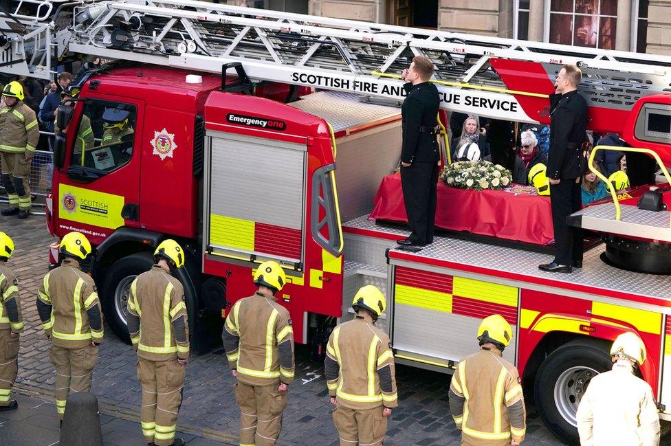 The coffin was carried on a fire engine