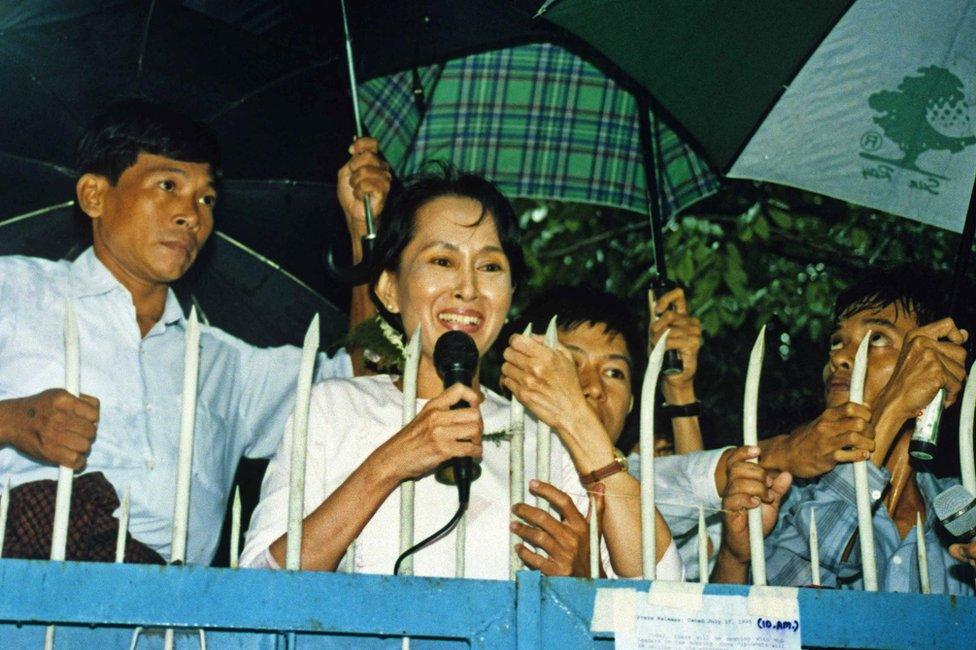 Aung San Suu Kyi addresses supporters after she was temporarily released from house arrest in July 1995