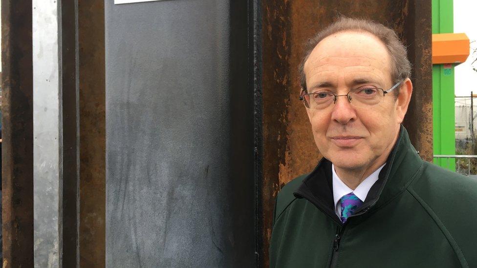 Sir James Bevan pictured at a flood defence in 2016